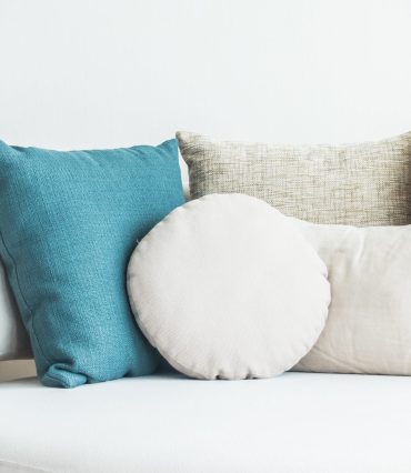 Beautiful pillow on sofa decoration in living room interior